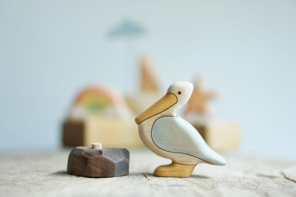Pelican wooden figurine with stone (painted)