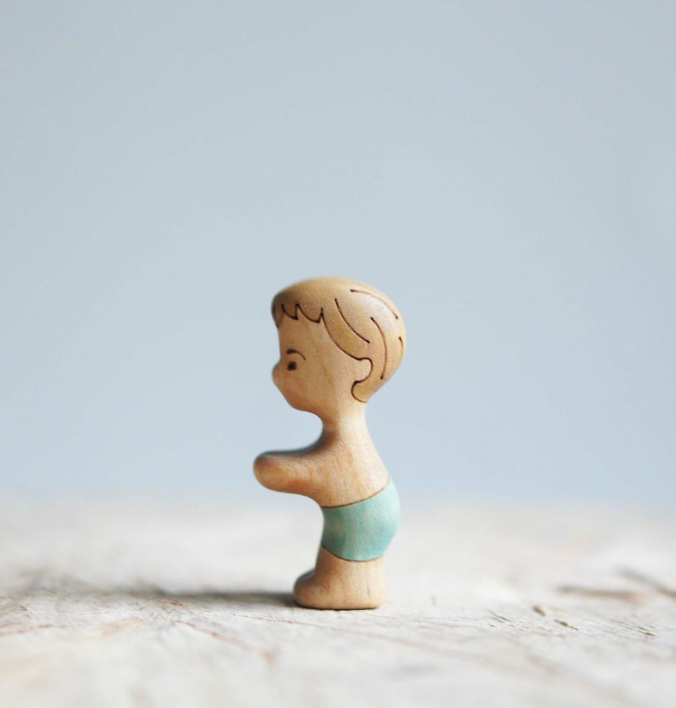 Boy younger  wooden toy (tanned skin)