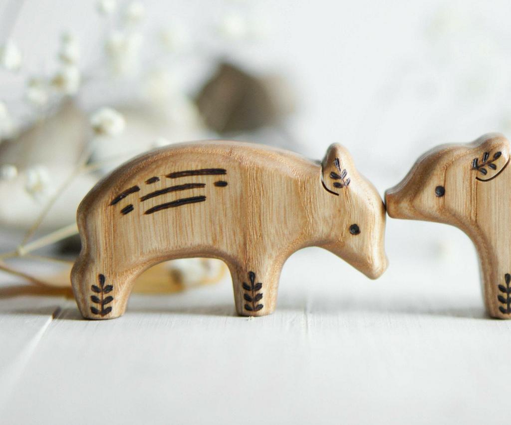Wooden boar baby head down