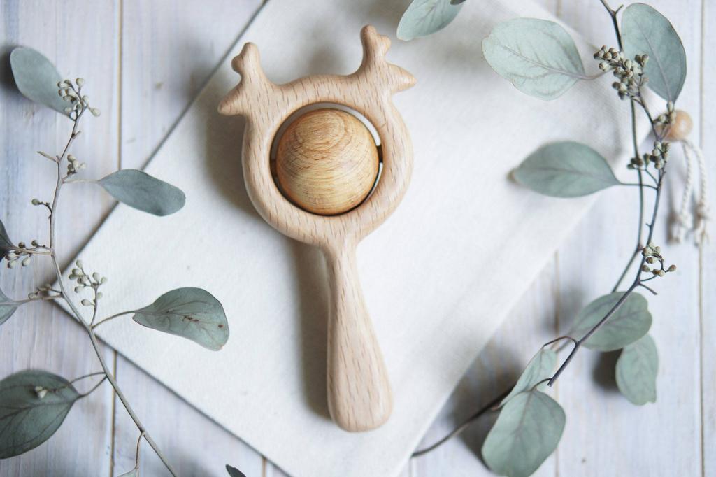Traditional wooden deer rattle