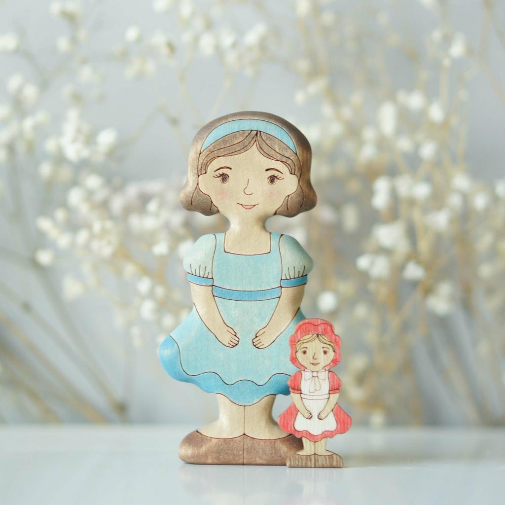 Girl with a doll (in blue)