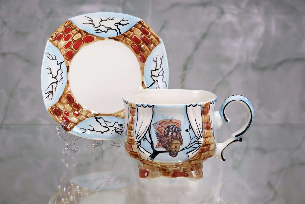 Handmade porcelain tea cup and saucer "Owl Traveler"